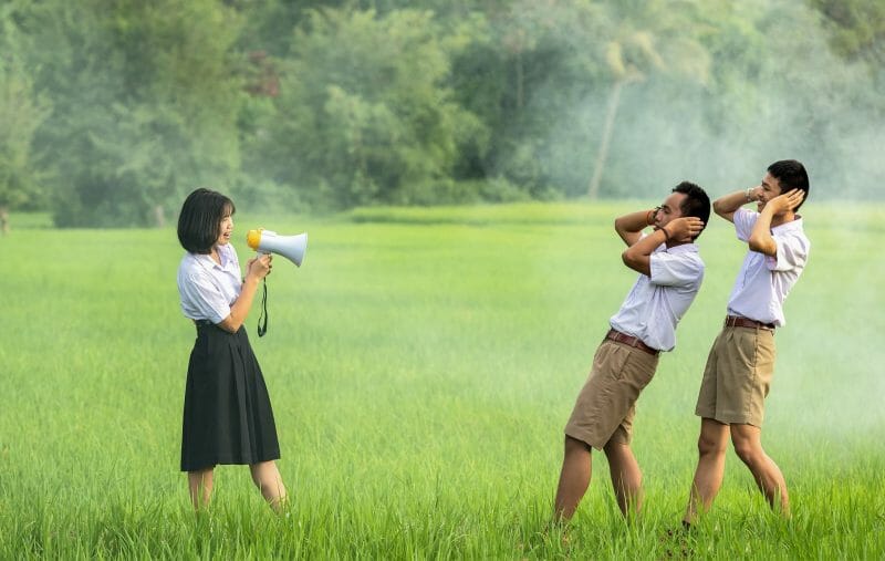 person speaking into a megaphone