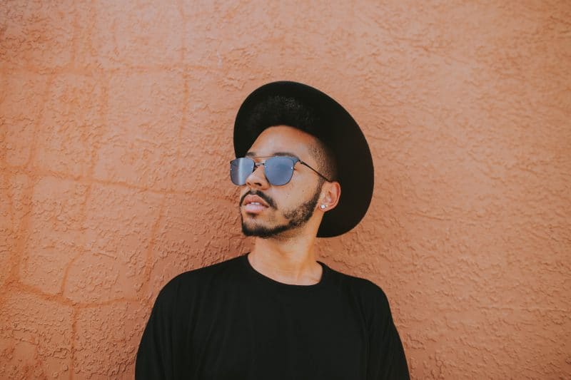 musician wearing a stylish black hat