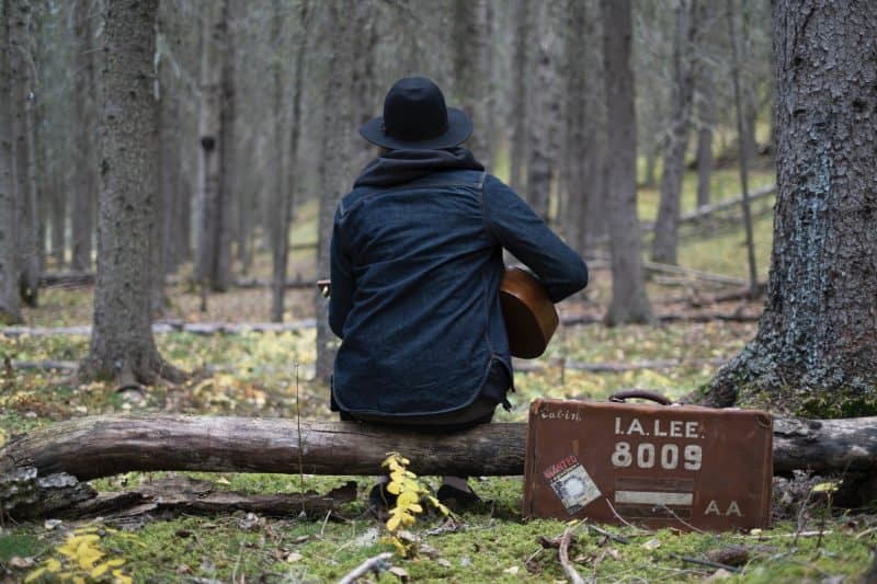 musician playing acoustic guitar