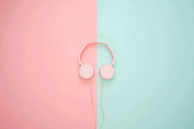pink headphones on blue and pink bakcground