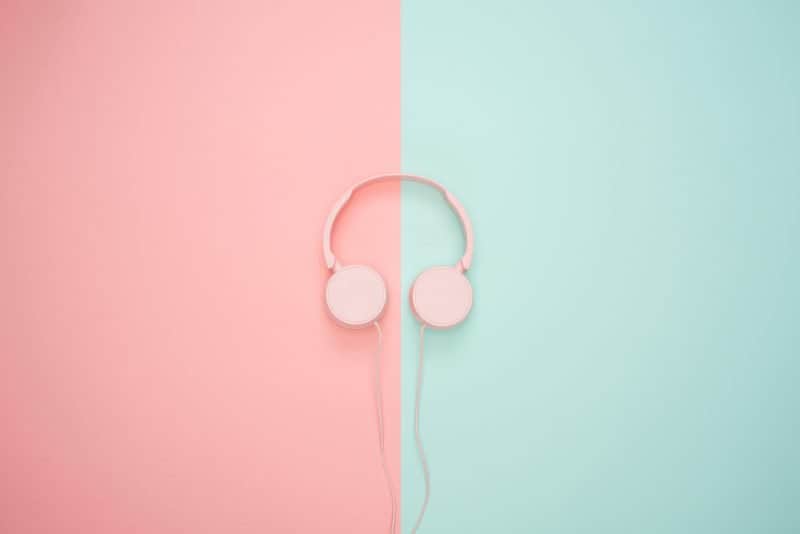 pink headphones on blue and pink bakcground