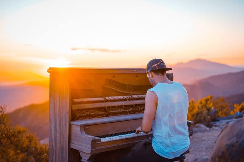 person playing piano outside