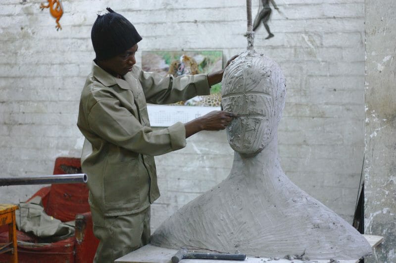 a sculptor creating a human face out of clay, similar to a sound designer subtracting frequencies from a synth