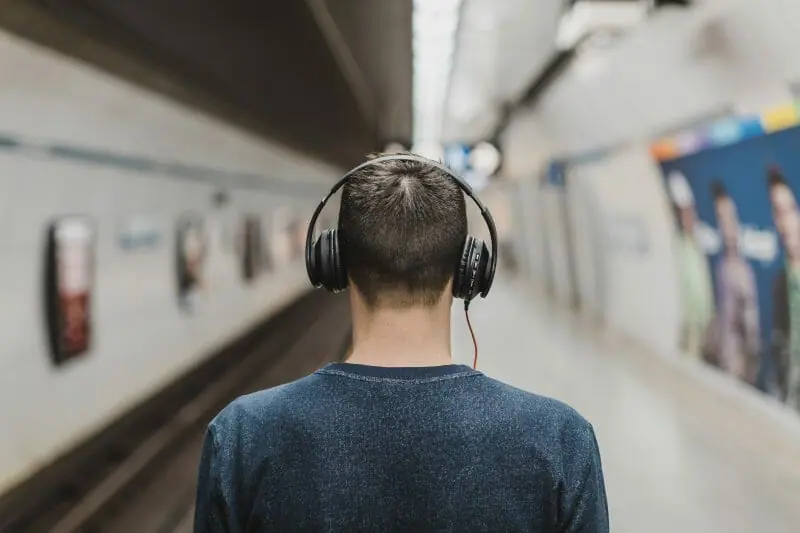 person listening to music with headphones