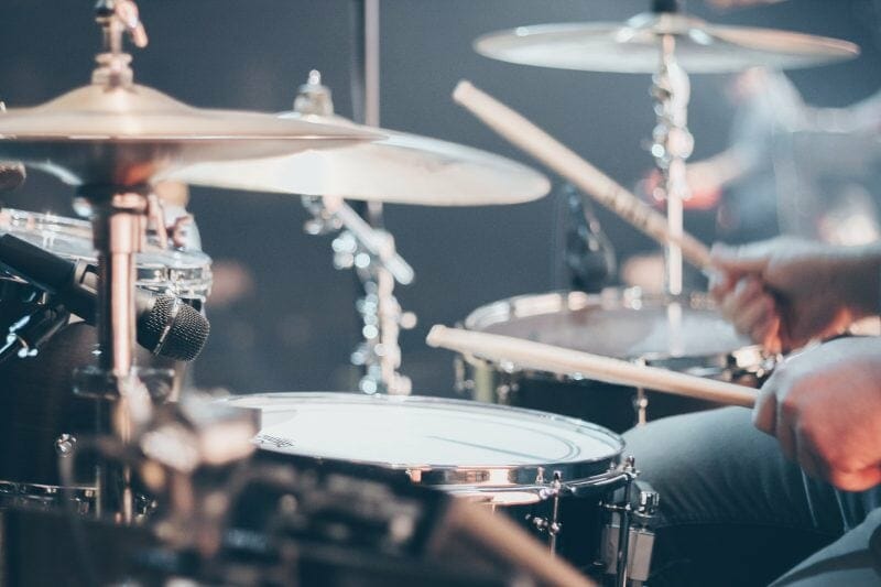 drummer playing a drum kit