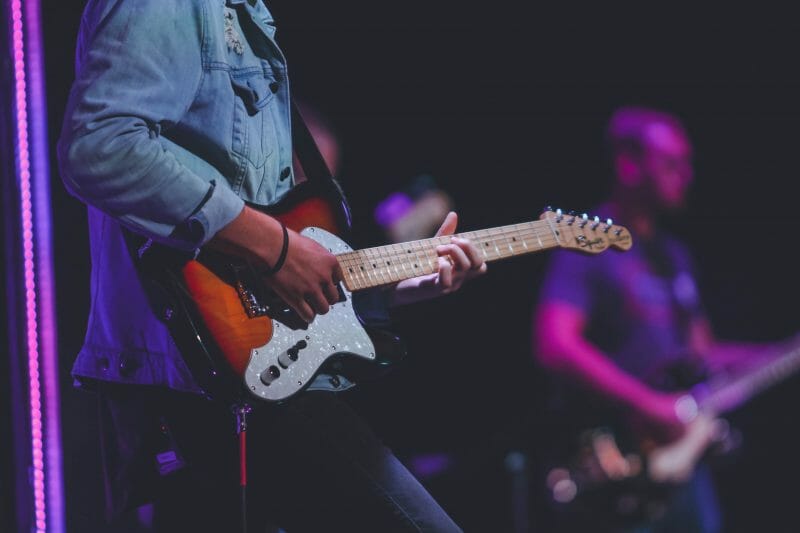 person playing guitar on stage
