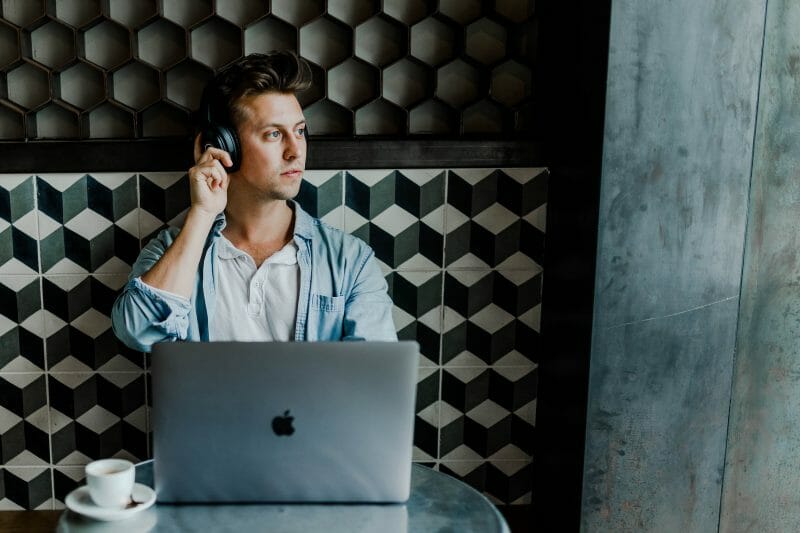 person listening to a mix inside of a coffee shop