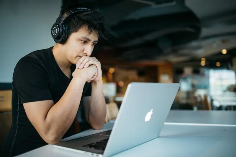 person listening carefully to music