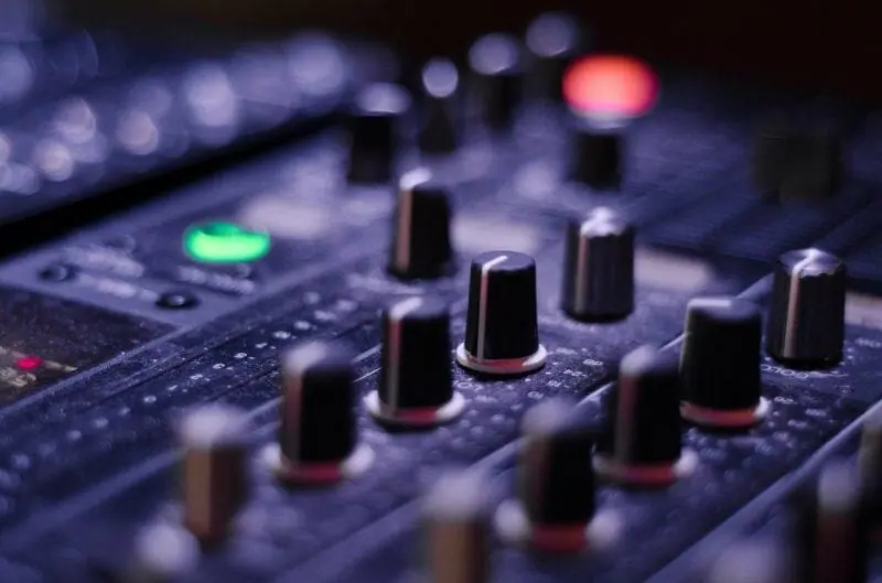 hardware eq knobs on a mixing console