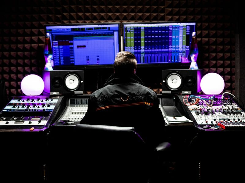 music producer in a mixing studio using pro tools