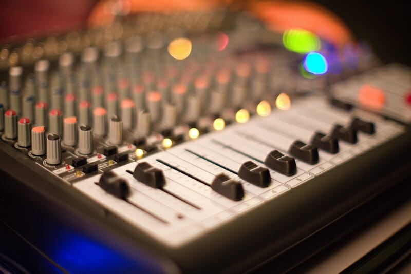 mixing faders on mixing console