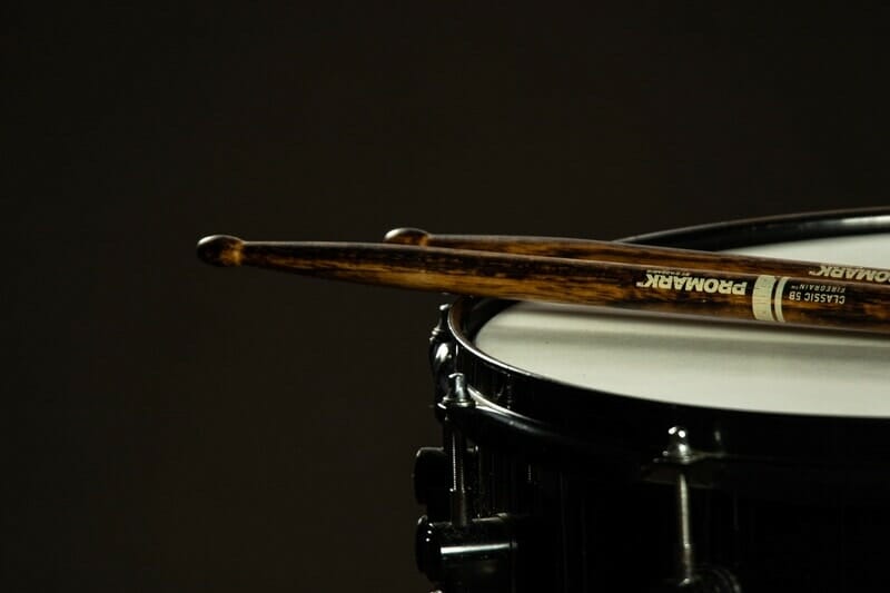 sticks set on a snare drum