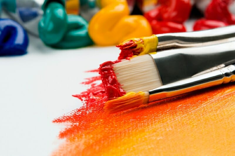 paint brushes to symbolize plugins that add color to your audio